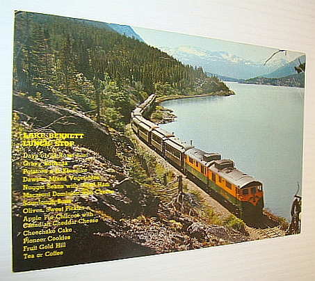 Image for Lake Bennett Lunch Stop: Picture Post Card (PPC) Colour Photo of a White Pass & Yukon Railway Train at Lake Bennett